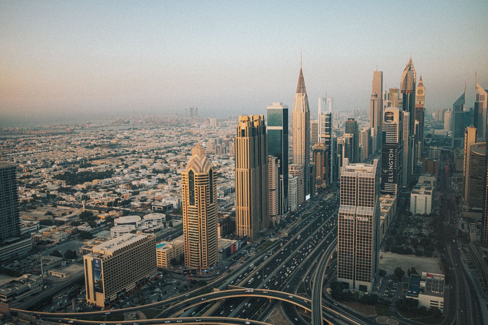 Aerial view of the Dubai skyline along Sheikh Zayed Road at dusk