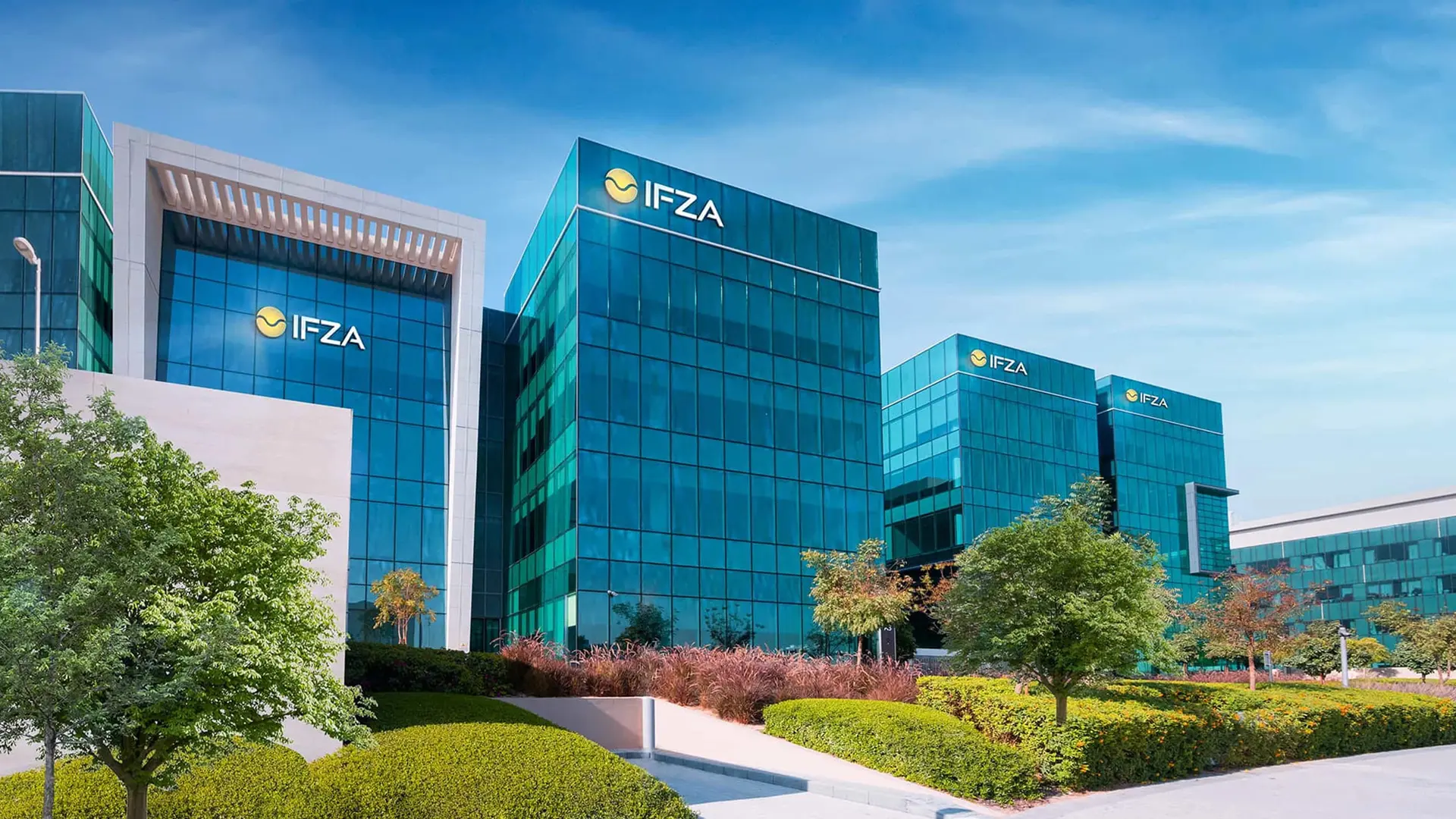 IFZA headquarters at Dubai Digital Park, Dubai Silicon Oasis — glass office buildings with IFZA signage